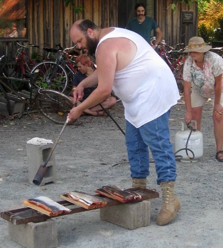 Rick visitor blackens salmon for holiday dinner. Pam assists.